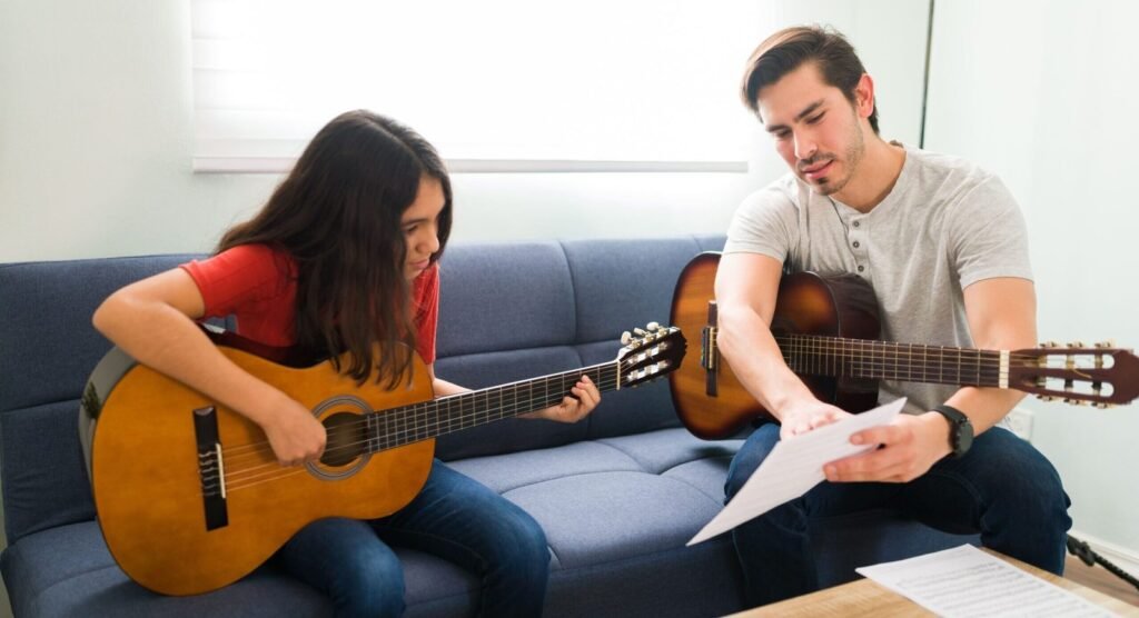 Guitar teacher providing in-person guitar lessons for kids and adults